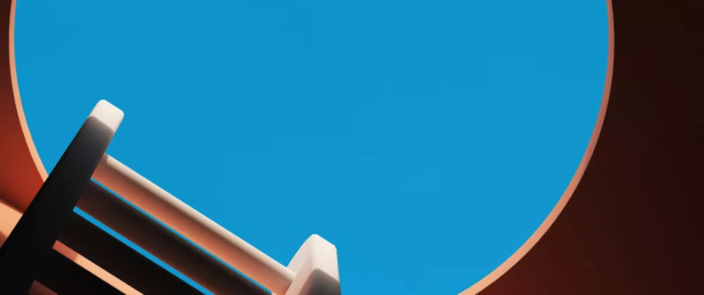 Minimalist abstract scene with a large blue circle framed by orange edges and angled geometric structures in the foreground.