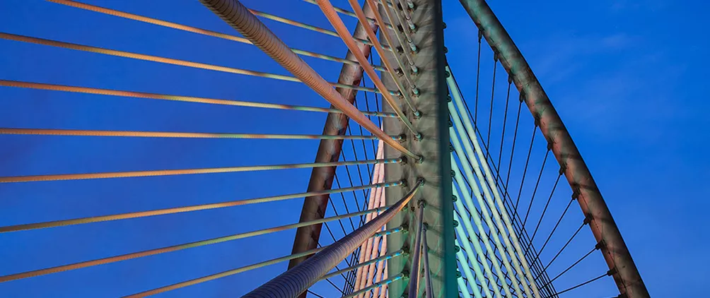 Bridge cables representing private credit strategies, portfolio structure and capital formation.