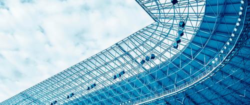 Blue-toned stadium roof representing sports infrastructure, private capital, stadium financing and year-round sports venue revenue opportunities.