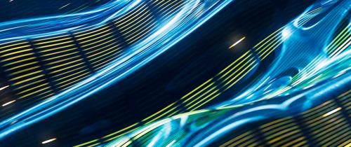 Abstract blue, green and yellow light trails representing digital infrastructure, AI investment and the AI supercycle.