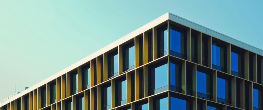 Modern building exterior representing commercial real estate, private markets and the 2026 mid-year real estate outlook.