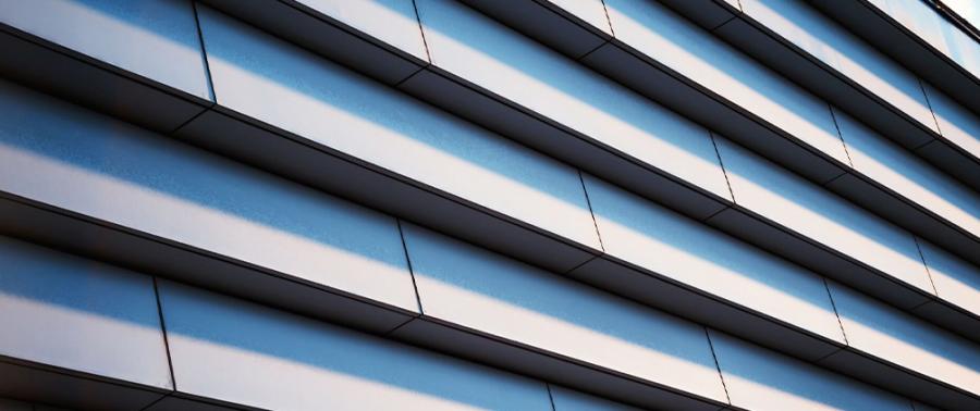 Modern building facade with layered horizontal lines representing CLO tranche thickness, structured credit and life insurer capital considerations.